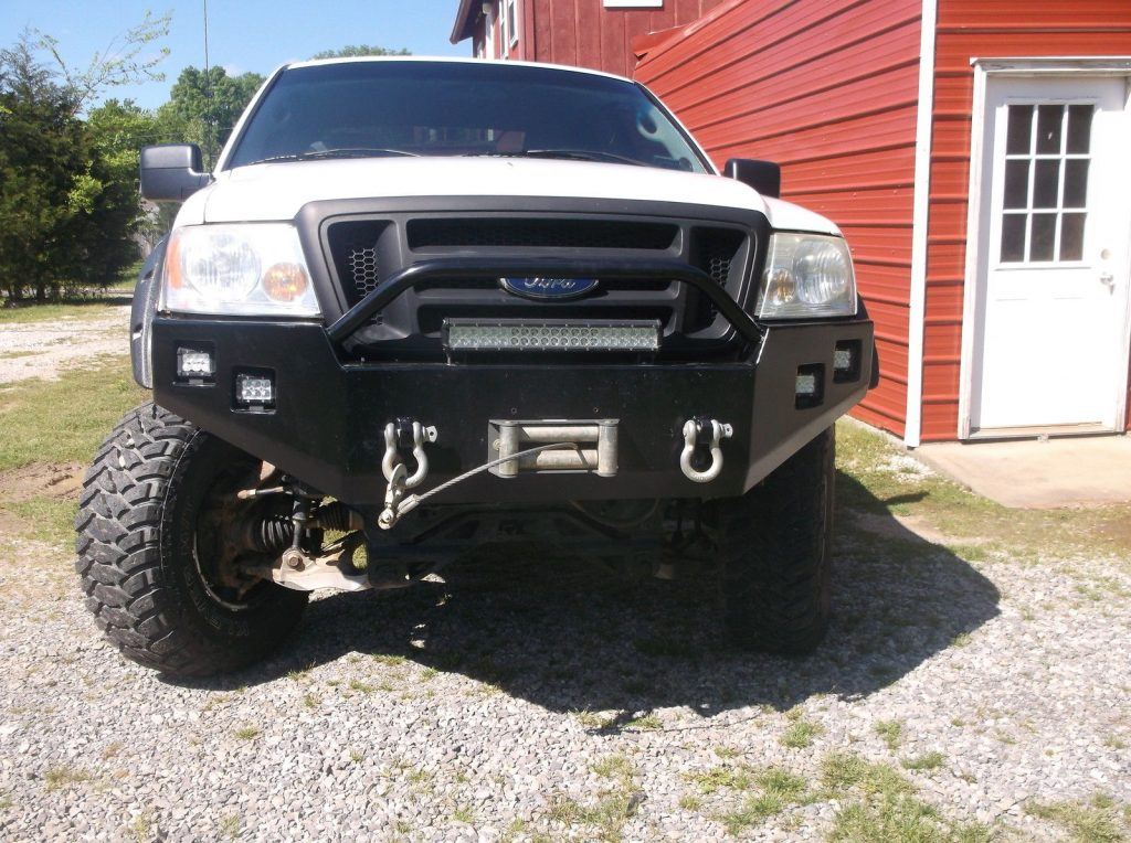 Customized 2007 Ford F 150 lifted with camper top