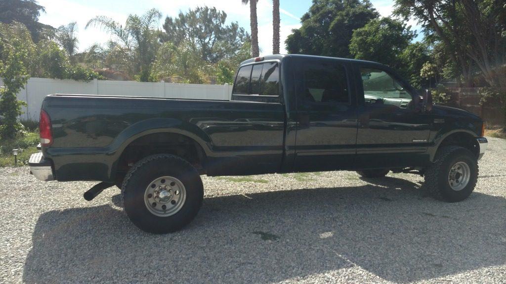 Green beast 2001 Ford F 250 Lariat lifted truck