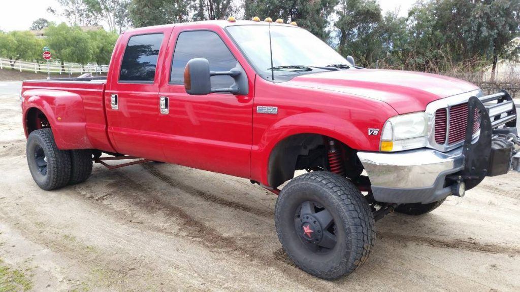 Red monster 1999 Ford F 350 lifted truck