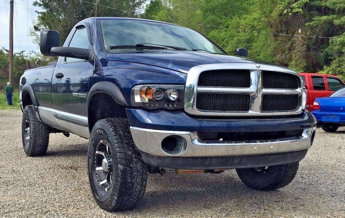 Smooth driver 2003 Dodge Ram 2500 slt lifted for sale