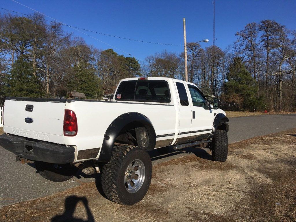 customized 1999 Ford F 250 Extended Cab XLT lifted