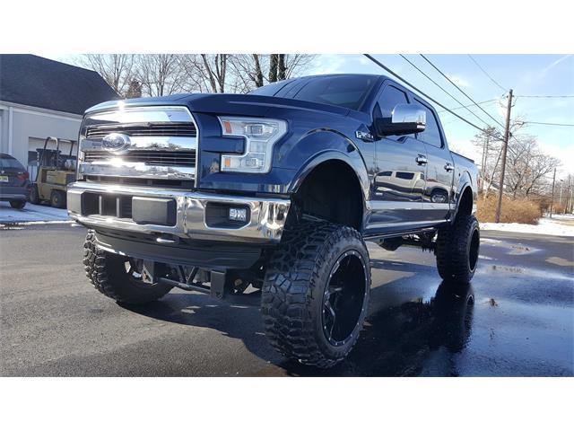 very low miles 2016 Ford F 150 Lariat lifted