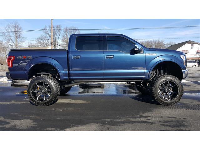 very low miles 2016 Ford F 150 Lariat lifted