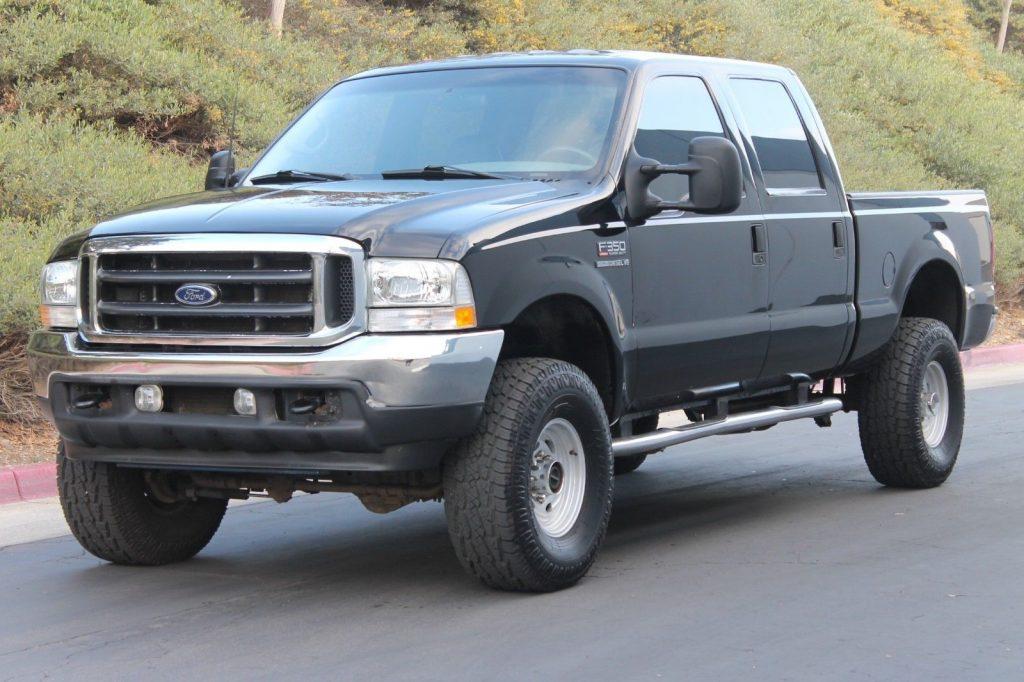 short bed 2002 Ford F 350 Lariat CREW CAB lifted