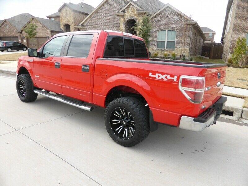 very nice 2014 Ford F 150 4WD Supercrew 145 XLT lifted